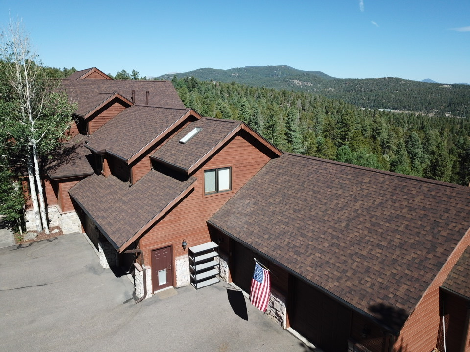brown asphalt shingle roofing on a residential home in the foothills of Evergreen CO