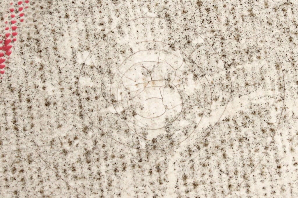 cracked damage mark from hail on a TPO flat roof