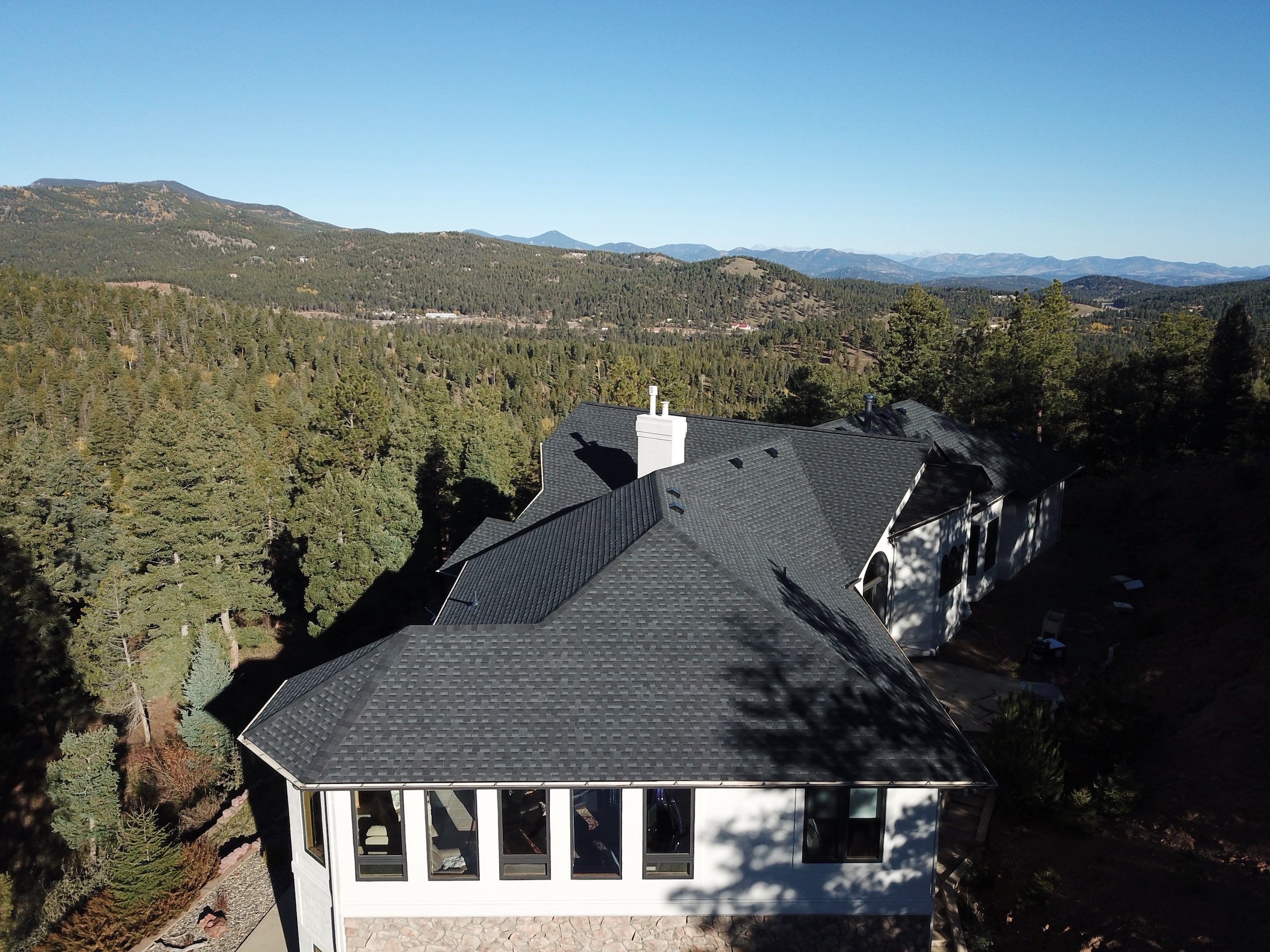 aerial view of a local residential Evergreen CO roof with asphalt shingles