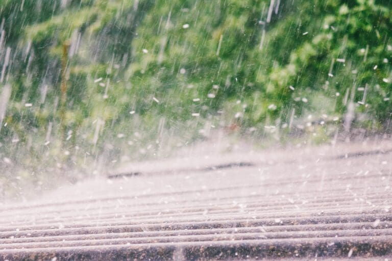 slate roof experiencing hail damage in a storm