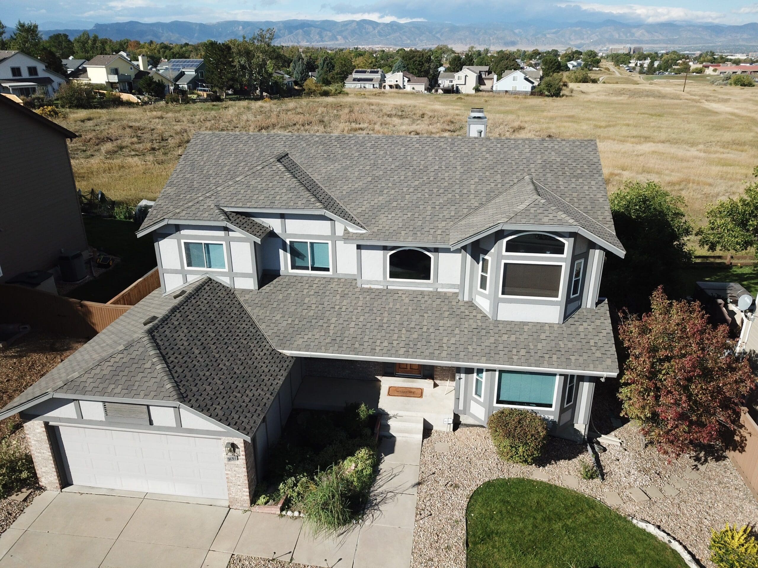 home in Highlands Ranch, Colorado with a new asphalt shingle roof installed by Table Mountain Roofing Group company
